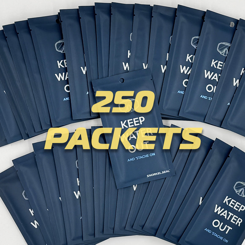 250 blue packets of Scuba Seal Mustache Barrier Seal that Stops mask leaks with yellow text on a white background