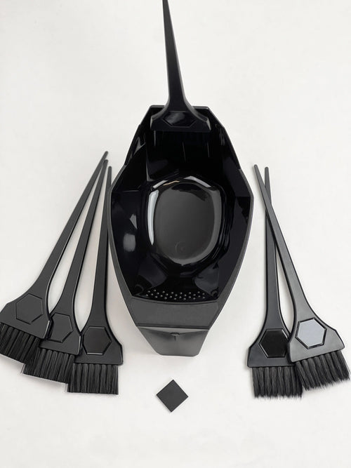 Black magnetic  hair dye mixing bowl with brushes on a white background