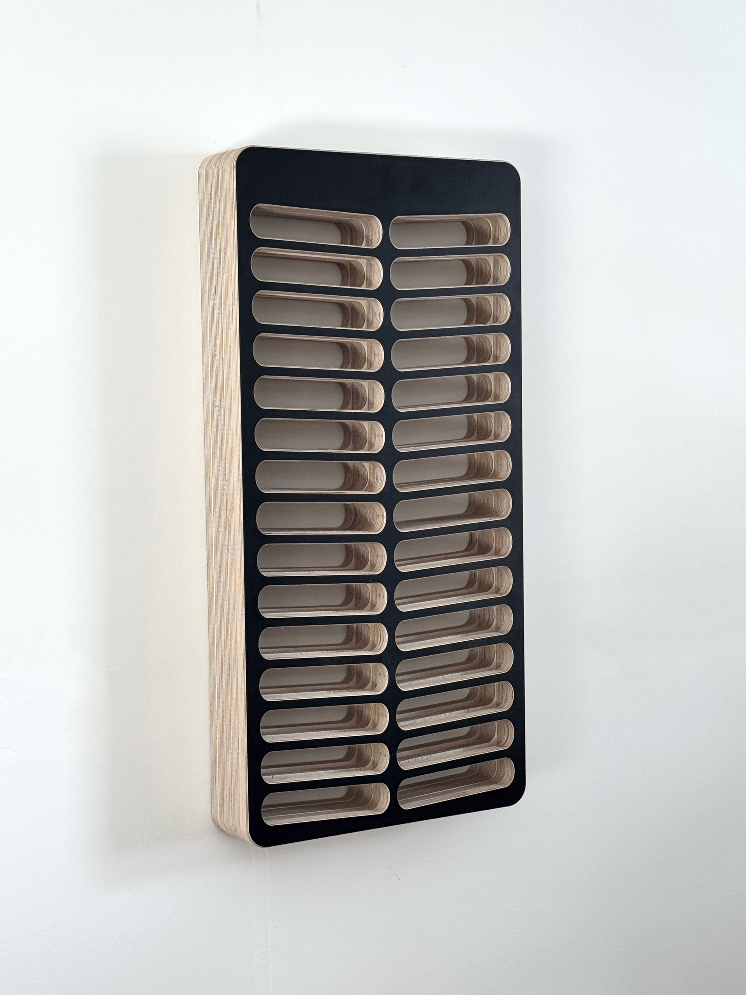 Wall-mounted hair dye organizer with multiple compartments on a white background